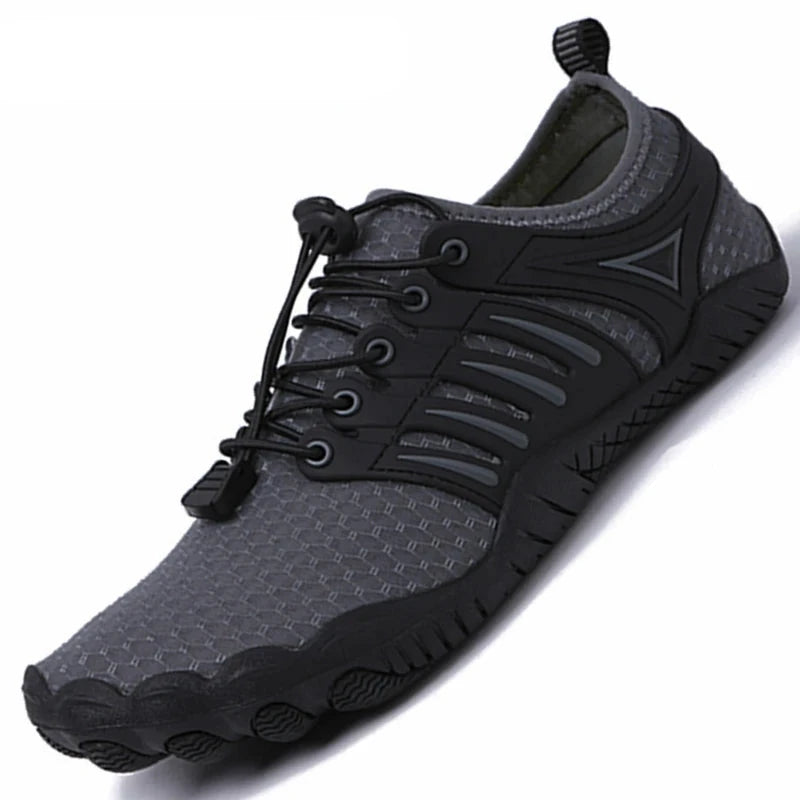 Black grey water shoe with elastic lace-up toggle tensioning closure and slip resistant rubber sole. Pictured on a white background.